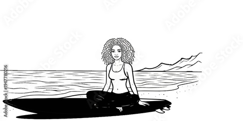 Woman with curly hair sits in meditation pose on surfboard at beach