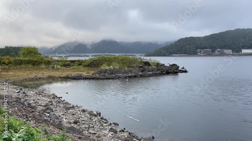 Scenic Lake Kawaguchi View with Bridge and Misty Mountains in Yamanashi Japan