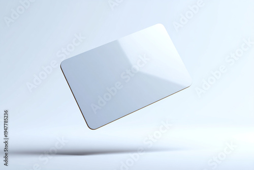 Blank white plastic credit card or gift card mockup floating in a bright, minimalist studio environment with soft shadows.
