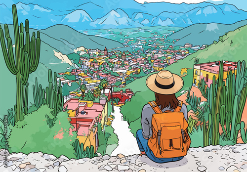 A person sits on a rocky ledge looking down at a colorful town nestled in the valley. Mountains and cacti fill the scene.
