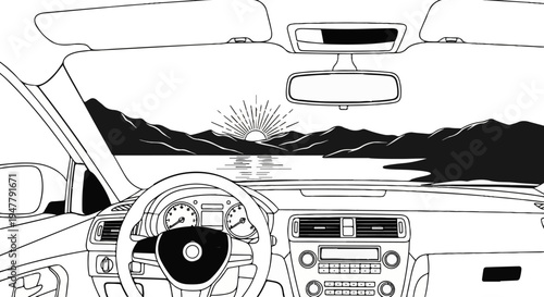 View from inside a car at sunrise over a lake and mountains