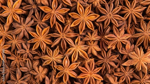 Aromatic Star Anise: An overhead perspective of star anise, showcasing its distinctive star-like shape and earthy color, evokes the essence of warm spices and culinary artistry.