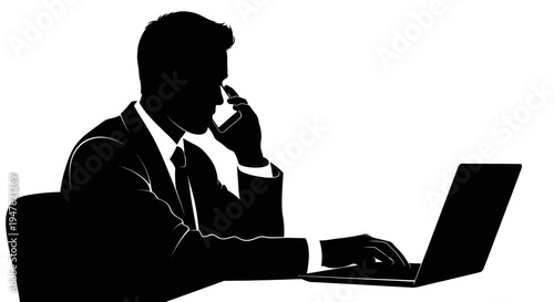 Silhouette of a businessman talking on the phone and working on a laptop at a desk.