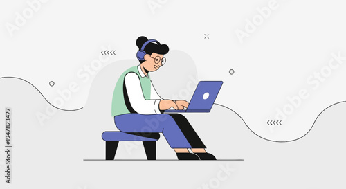 Person wearing headphones works on laptop while sitting on a stool
