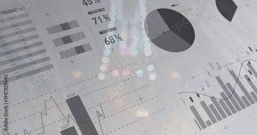 Displaying grayscale financial dashboard at office, with pie chart, bar charts, 45% 71% 68% labels