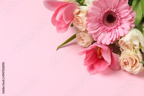 Beautiful bouquet of spring flowers on pink background. Mother's Day concept