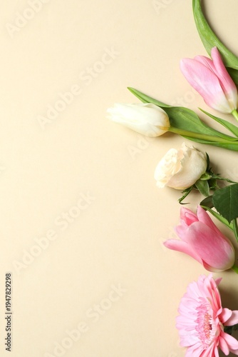 Mother's Day concept. Top view photo of bouquet of flowers on isolated pastel background with copyspace