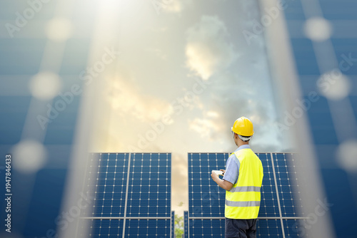 Technician monitoring solar farm system for utility scale renewable energy performance