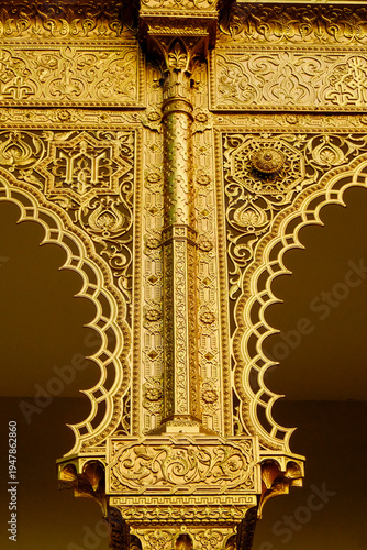 . Intricate gold architectural detail with ornate decorative patterns