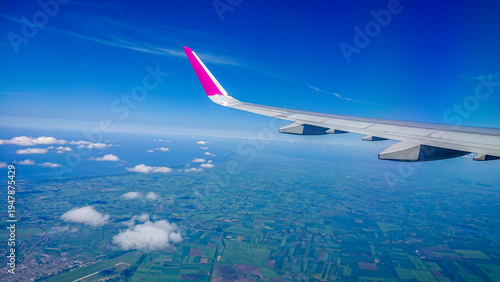 Aftersunset sky, bright blue, dotted with soft white clouds