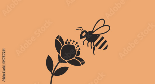 Black bee flying to flower.