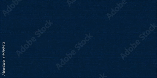 Blue denim fabric texture background with rough cotton textile pattern in dark blue color
