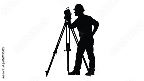A man in a hard hat looks through a surveyors instrument