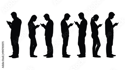 A group of people standing and looking at their phones