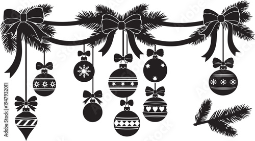 Black and white Christmas ornaments hanging from a garland
