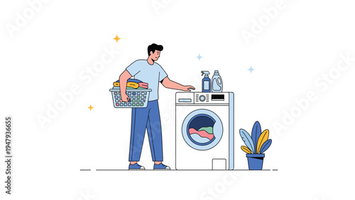 Young man in a blue shirt carrying a basket of clothes while standing next to a washing machine doing housework.