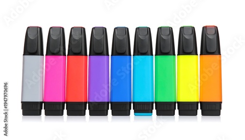 Colorful highlighters standing in a neat row, caps on, reflecting on the surface against a white backdrop