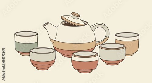 Traditional ceramic teapot with matching cups arranged for tea serving.