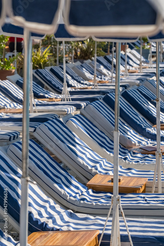 Luxury Beach Club with Blue Striped Umbrellas in Nice France
