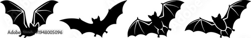A collection of four distinct black bat silhouettes isolated on a plain white background for design