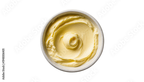 фотографія Isolated soft creamy butter in a small bowl with decorative swirl ready for cook