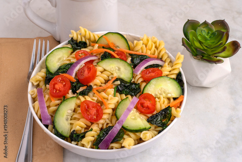 Bild auf Leinwand rotini pasta salad  with  tomatoes and cucumbers