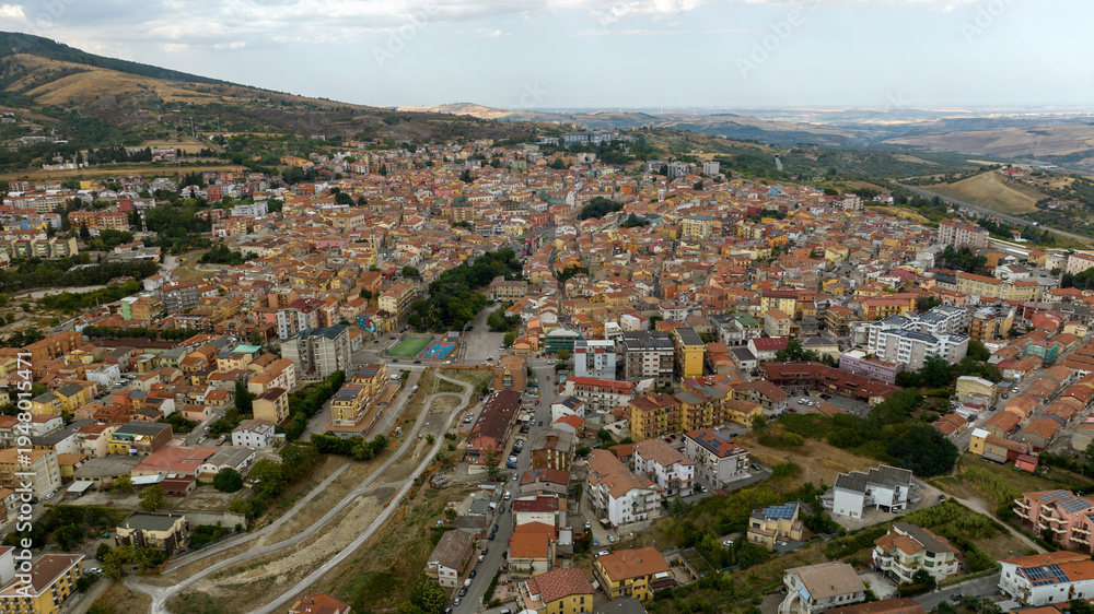 Obraz premium Aerial view of the city of Rionero in Vulture, located in the province of Potenza, Basilicata, Italy. Panorama of a dense cluster of historic buildings with the sky in background.