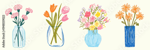 Colorful flowers in different vases on a table