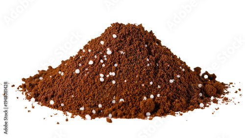Isolated heap of rich brown granulated powder and white spherical sweetening particles.