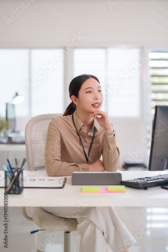 Asian adult woman professional thinking business strategy planning corporate project modern office workspace