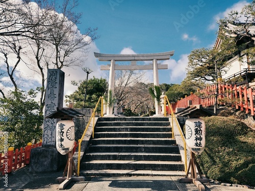 Fotografie Stone torii gate and steps at Kenkun Shrine in Kyoto Japan