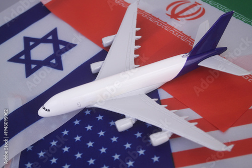 Flags of America, Israel and Iran with airplane. War between US-Israel and Iran concept and flight cancelation.