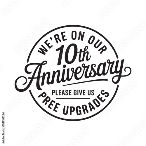 A black and white circular badge celebrating a tenth anniversary milestone