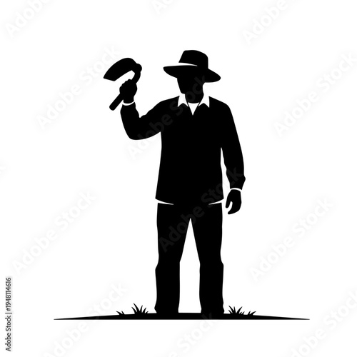Silhouette of a farmer or gardener wearing a hat and holding a hoe, standing on a patch of grass.