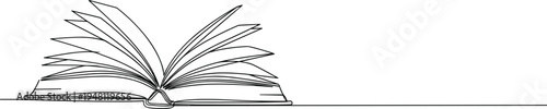 Open book on table with pages fanned out black and white