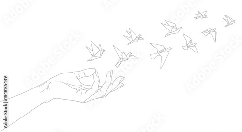 Hand releasing flying birds into air.