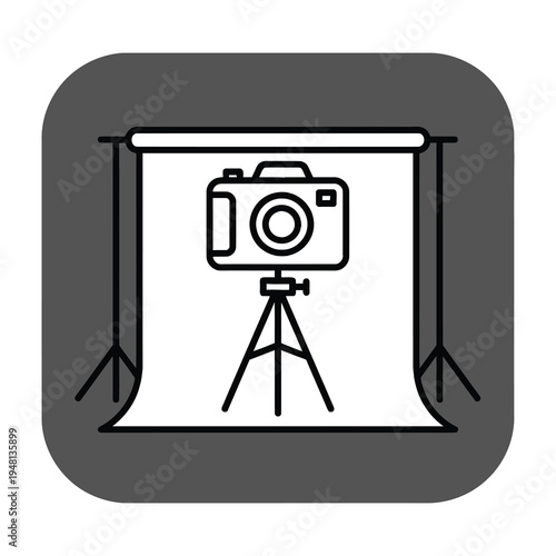 Professional photography setup featuring a camera mounted on a sturdy tripod positioned under a softbox lighting frame for flawless studio portraits and product shots