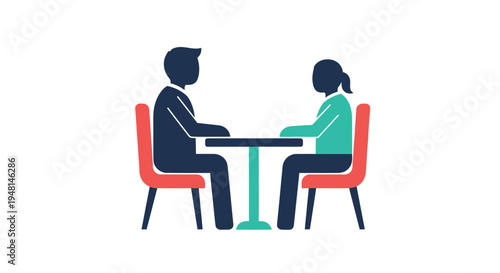 Two people sitting at table.