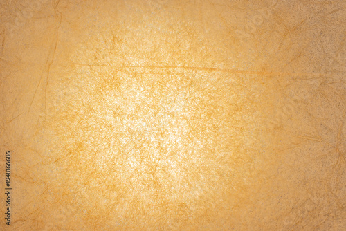 Warm beige fiber texture background with soft bright center