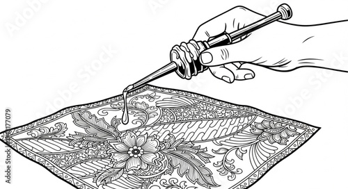 Hand applying liquid with syringe to patterned surface.