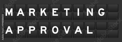 Black color analog flip board with word marketing approval on gray background