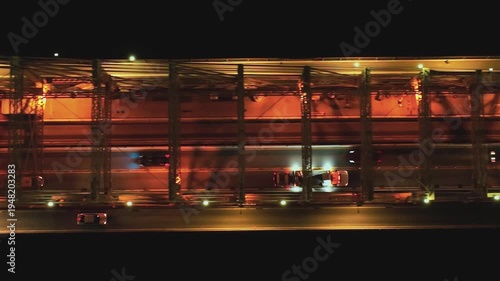 View of traffic on a bridge in New York at night under street lights