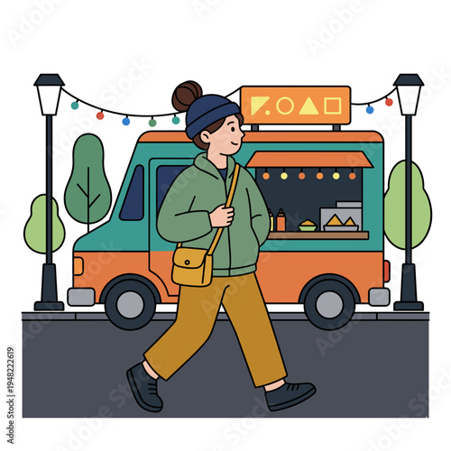 Young tourist walking past illuminated street food truck at night city travel and street food concept