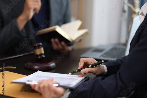 Canvastavla Lawyers discussing contract, working with legal documents, gavel and laptop on desk