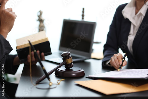 Cuadro en lienzo Lawyers discussing contract, working with legal documents, gavel and laptop on desk