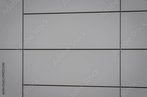 Grey exterior wall panels creating architecture background texture