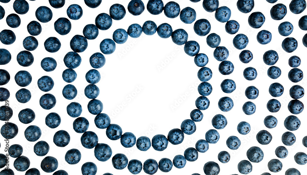 Fototapeta premium Fresh blueberries arranged in a circular pattern on a white surface.