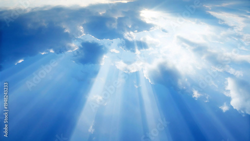Quadro su tela Dramatic blue sky with sun rays shining through fluffy white clouds