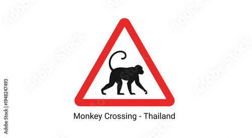 Bold graphic warning sign displaying a black silhouette of a monkey within a red triangle, signaling a wildlife crossing area for safety awareness on public roads and highways