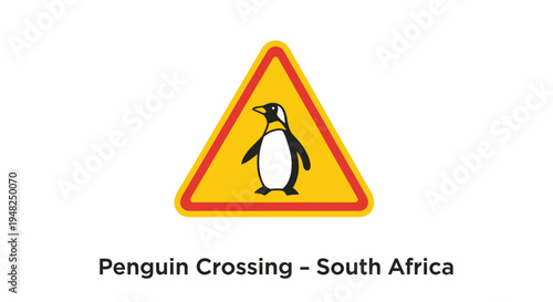 Yellow triangular warning sign featuring a black penguin silhouette, commonly seen in coastal regions, alerts drivers to potential wildlife crossings and promotes road safety for animals